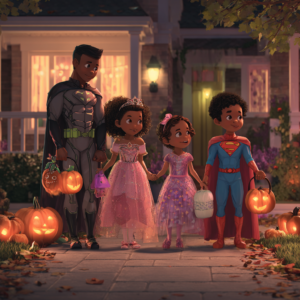 A father wearing a batman costume with 2 black girls wearing princess costumes and a black bot wearin a superman costumes practices Halloween for Neurodiverse kids