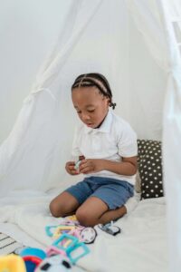 a child playing with his toys (ADHD vs Sensory Processing Disorder). 