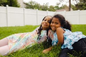 Neurodiverse Kids Casually laying on Grass.